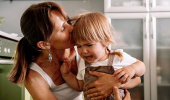 Young,Mother,Tries,To,Calm,Her,Crying,Little,Daughter.,Raising