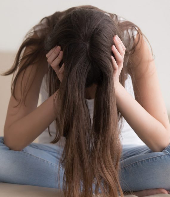 Depressed,Teenager,Sitting,Holding,Head,In,Hands,,Stressed,Sad,Young